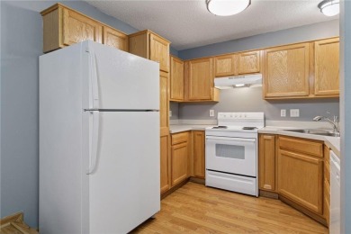 Move-in ready interior townhome. Main floor features living room on Chomonix Golf Course in Minnesota - for sale on GolfHomes.com, golf home, golf lot