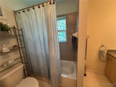 This beautiful custom home features three bedrooms and a on Citrus Springs Country Club in Florida - for sale on GolfHomes.com, golf home, golf lot
