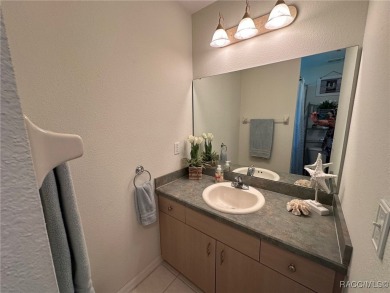This beautiful custom home features three bedrooms and a on Citrus Springs Country Club in Florida - for sale on GolfHomes.com, golf home, golf lot