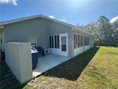 This beautiful custom home features three bedrooms and a on Citrus Springs Country Club in Florida - for sale on GolfHomes.com, golf home, golf lot