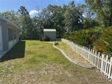 This beautiful custom home features three bedrooms and a on Citrus Springs Country Club in Florida - for sale on GolfHomes.com, golf home, golf lot