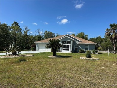 This beautiful custom home features three bedrooms and a on Citrus Springs Country Club in Florida - for sale on GolfHomes.com, golf home, golf lot