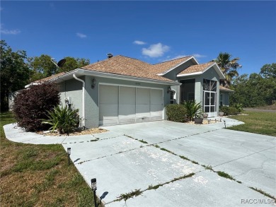 This beautiful custom home features three bedrooms and a on Citrus Springs Country Club in Florida - for sale on GolfHomes.com, golf home, golf lot