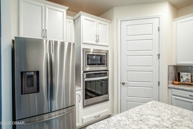 Exquisite 3-Bed, 3-Bath. 3-Car Garage Retreat in Halifax on Halifax Plantation Golf Club in Florida - for sale on GolfHomes.com, golf home, golf lot