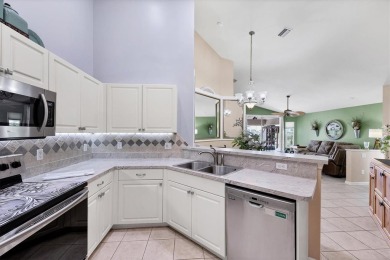 Nestled in the highly sought after gated community of Villas of on Sabal Trace Golf and Country Club in Florida - for sale on GolfHomes.com, golf home, golf lot