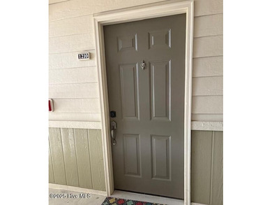 Experience coastal living at its finest in this meticulously on Crow Creek Golf Club in North Carolina - for sale on GolfHomes.com, golf home, golf lot