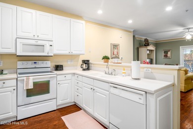 Experience coastal living at its finest in this meticulously on Crow Creek Golf Club in North Carolina - for sale on GolfHomes.com, golf home, golf lot