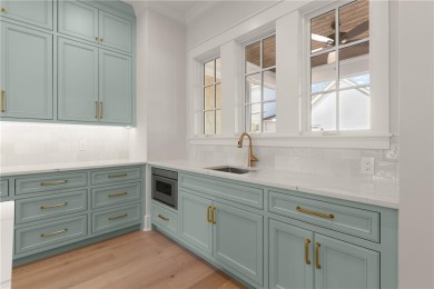 With grays, greens and classic cedar texture, this cottage on Frederica Golf Club in Georgia - for sale on GolfHomes.com, golf home, golf lot