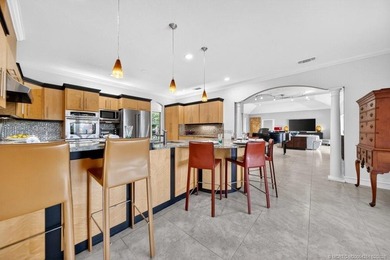 Located within the 24-hour manned, gated Evergreen Club, this on  in Florida - for sale on GolfHomes.com, golf home, golf lot