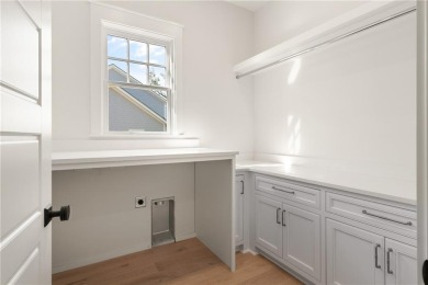 With grays, greens and classic cedar texture, this cottage on Frederica Golf Club in Georgia - for sale on GolfHomes.com, golf home, golf lot