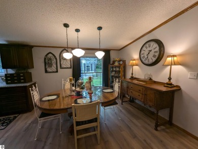 An immaculate home with deeded beach access along Lake Huron in on Singing Bridge Golf Course in Michigan - for sale on GolfHomes.com, golf home, golf lot