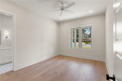 With grays, greens and classic cedar texture, this cottage on Frederica Golf Club in Georgia - for sale on GolfHomes.com, golf home, golf lot