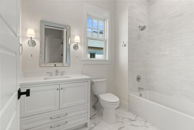 With grays, greens and classic cedar texture, this cottage on Frederica Golf Club in Georgia - for sale on GolfHomes.com, golf home, golf lot