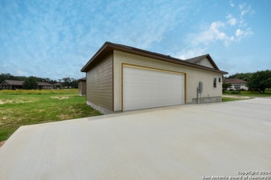 Magnificent custom home with oversized lot on the golf course in on Devine Golf Course in Texas - for sale on GolfHomes.com, golf home, golf lot