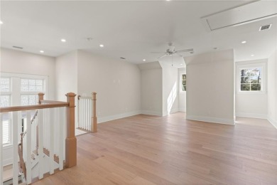 With grays, greens and classic cedar texture, this cottage on Frederica Golf Club in Georgia - for sale on GolfHomes.com, golf home, golf lot