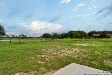 Magnificent custom home with oversized lot on the golf course in on Devine Golf Course in Texas - for sale on GolfHomes.com, golf home, golf lot