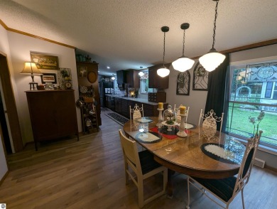 An immaculate home with deeded beach access along Lake Huron in on Singing Bridge Golf Course in Michigan - for sale on GolfHomes.com, golf home, golf lot