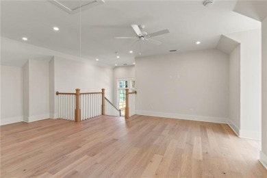 With grays, greens and classic cedar texture, this cottage on Frederica Golf Club in Georgia - for sale on GolfHomes.com, golf home, golf lot