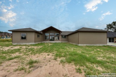 Magnificent custom home with oversized lot on the golf course in on Devine Golf Course in Texas - for sale on GolfHomes.com, golf home, golf lot