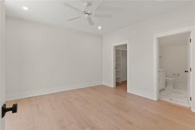 With grays, greens and classic cedar texture, this cottage on Frederica Golf Club in Georgia - for sale on GolfHomes.com, golf home, golf lot