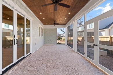 With grays, greens and classic cedar texture, this cottage on Frederica Golf Club in Georgia - for sale on GolfHomes.com, golf home, golf lot