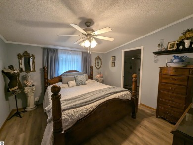 An immaculate home with deeded beach access along Lake Huron in on Singing Bridge Golf Course in Michigan - for sale on GolfHomes.com, golf home, golf lot