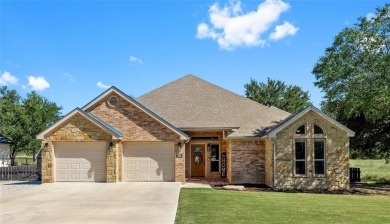 Experience luxury living on the 10th fairway of The Hideout Golf on Hideout Golf Club and Resort  in Texas - for sale on GolfHomes.com, golf home, golf lot