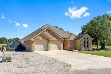 Experience luxury living on the 10th fairway of The Hideout Golf on Hideout Golf Club and Resort  in Texas - for sale on GolfHomes.com, golf home, golf lot