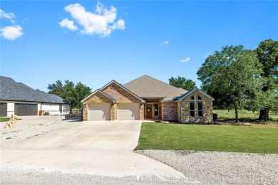 Experience luxury living on the 10th fairway of The Hideout Golf on Hideout Golf Club and Resort  in Texas - for sale on GolfHomes.com, golf home, golf lot