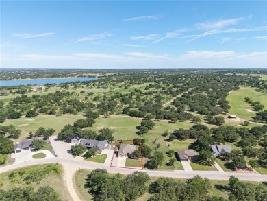 Experience luxury living on the 10th fairway of The Hideout Golf on Hideout Golf Club and Resort  in Texas - for sale on GolfHomes.com, golf home, golf lot