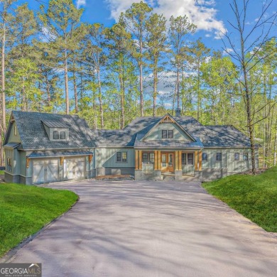 Stunning Lakefront Luxury Home in Reynolds Landing with Sunset for sale on GolfHomes.com