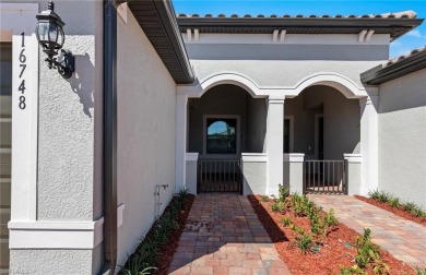 Enjoy low-maintenance, resort-style living in this beautifully on River Hall Country Club in Florida - for sale on GolfHomes.com, golf home, golf lot
