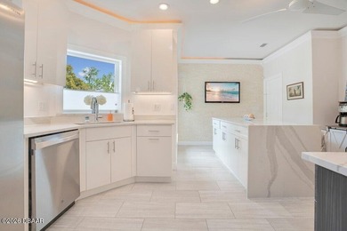 Drenched in natural light and beautifully upgraded throughout on  in Florida - for sale on GolfHomes.com, golf home, golf lot