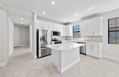 Enjoy low-maintenance, resort-style living in this beautifully on River Hall Country Club in Florida - for sale on GolfHomes.com, golf home, golf lot