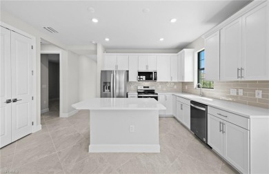 Enjoy low-maintenance, resort-style living in this beautifully on River Hall Country Club in Florida - for sale on GolfHomes.com, golf home, golf lot