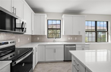 Enjoy low-maintenance, resort-style living in this beautifully on River Hall Country Club in Florida - for sale on GolfHomes.com, golf home, golf lot