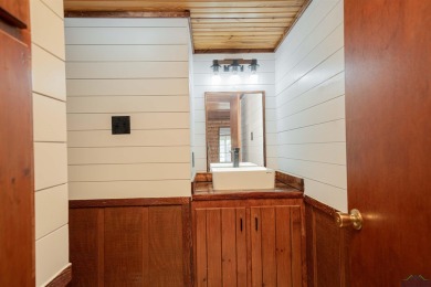 EAST TEXAS DREAM - Fabulous log home with wraparound porches on Southern Hills Golf Club in Texas - for sale on GolfHomes.com, golf home, golf lot