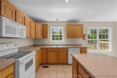 Welcome to Carolina Seasons! This charming 3-bedroom, 2.5-bath on Ponderosa Golf Club in North Carolina - for sale on GolfHomes.com, golf home, golf lot