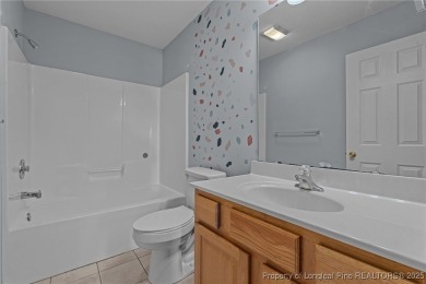 Welcome to Carolina Seasons! This charming 3-bedroom, 2.5-bath on Ponderosa Golf Club in North Carolina - for sale on GolfHomes.com, golf home, golf lot