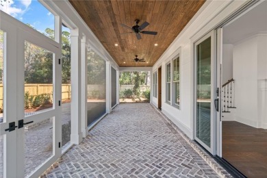 Distinctly Southern details and warm materials blend seamlessly on Frederica Golf Club in Georgia - for sale on GolfHomes.com, golf home, golf lot