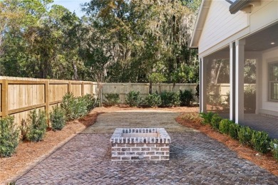 Distinctly Southern details and warm materials blend seamlessly on Frederica Golf Club in Georgia - for sale on GolfHomes.com, golf home, golf lot