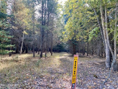 Beautifully parked out wooded level 5 acre parcel in Wilderness on Mirror Lake Golf Course in Idaho - for sale on GolfHomes.com, golf home, golf lot