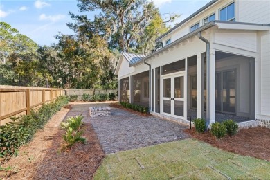 Distinctly Southern details and warm materials blend seamlessly on Frederica Golf Club in Georgia - for sale on GolfHomes.com, golf home, golf lot