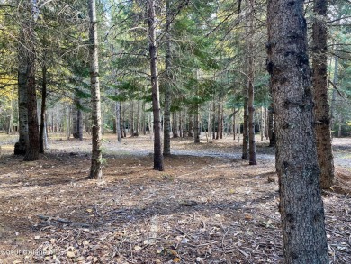 Beautifully parked out wooded level 5 acre parcel in Wilderness on Mirror Lake Golf Course in Idaho - for sale on GolfHomes.com, golf home, golf lot
