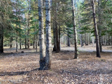 Beautifully parked out wooded level 5 acre parcel in Wilderness on Mirror Lake Golf Course in Idaho - for sale on GolfHomes.com, golf home, golf lot