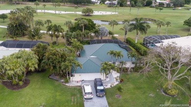 4BR/2.5 bath home on the 5th hole in exclusive Yacht and Country on Yacht and Country Club in Florida - for sale on GolfHomes.com, golf home, golf lot