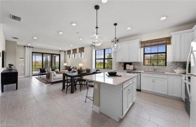 Enjoy low-maintenance, resort-style living in this beautifully on River Hall Country Club in Florida - for sale on GolfHomes.com, golf home, golf lot