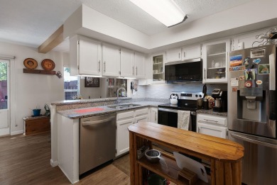 Beautifully Updated Townhouse located in the Villa Encantada on Arroyo Del Oso Golf Course in New Mexico - for sale on GolfHomes.com, golf home, golf lot