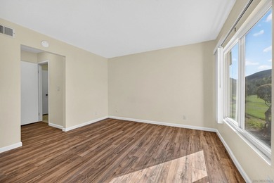 Ground-level ease, elevated living. Perfectly positioned as a on Lake San Marcos Country Club- South Course in California - for sale on GolfHomes.com, golf home, golf lot