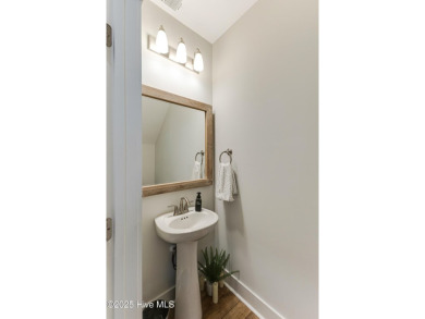This gorgeous townhome resides in the Smithfield III section of on Brunswick Plantation and Golf Resorts in North Carolina - for sale on GolfHomes.com, golf home, golf lot